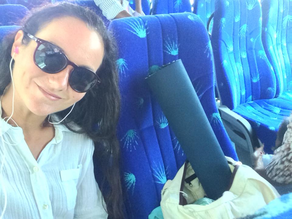 Patricia travels in a public bus with her yoga mat