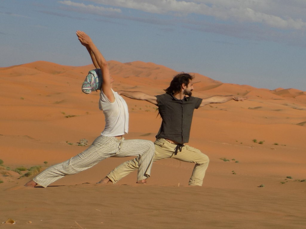 Patricia and Angelo, your yoga teachers at Light Love and Yoga Crete, Plaka, Almyrida, Apokoronas holding yoga postures in a desert